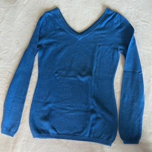Blue, low v neck sweater.